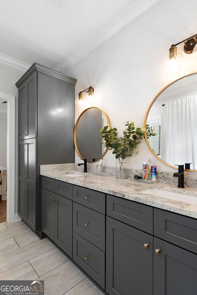 bathroom featuring double vanity, a sink, and ornamental molding