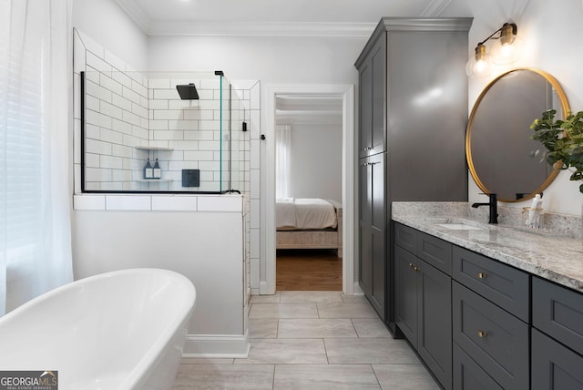 ensuite bathroom featuring marble finish floor, vanity, ornamental molding, a freestanding tub, and tiled shower
