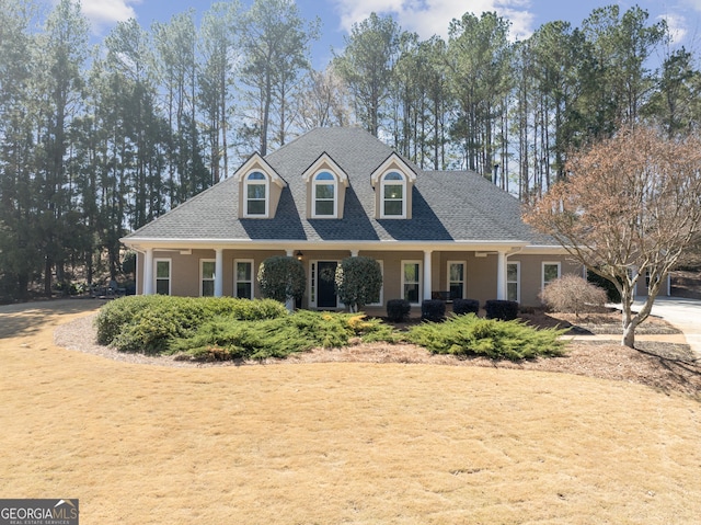 view of front of property with roof with shingles