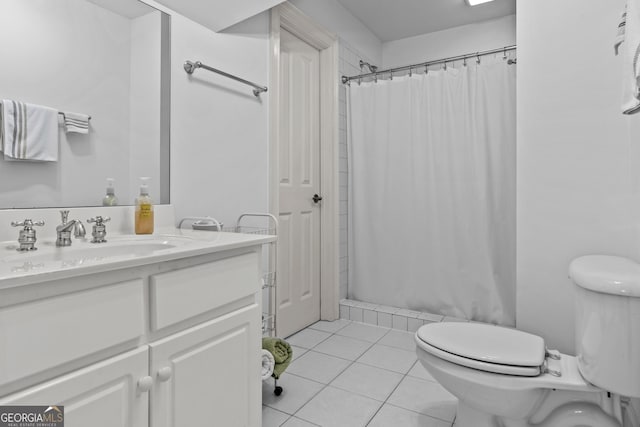 full bathroom featuring curtained shower, toilet, vanity, and tile patterned flooring