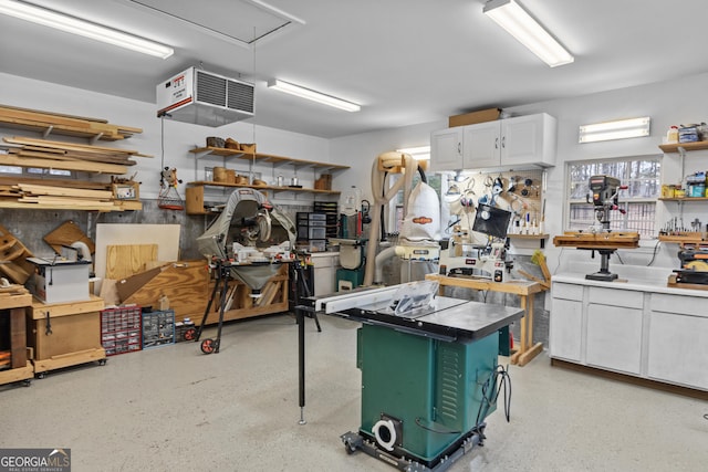 interior space featuring a workshop area and a heating unit