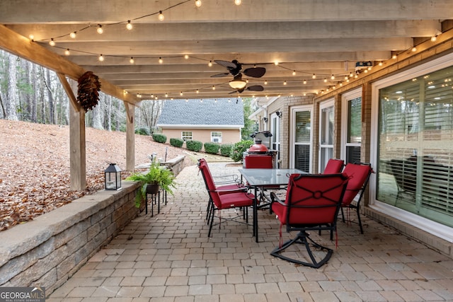 view of patio with outdoor dining space and ceiling fan