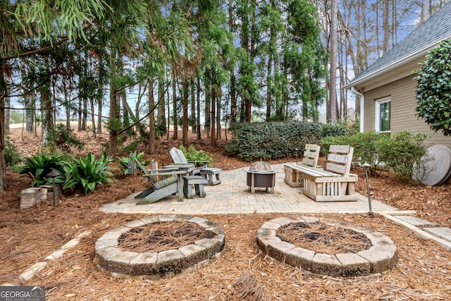 view of patio / terrace with an outdoor fire pit