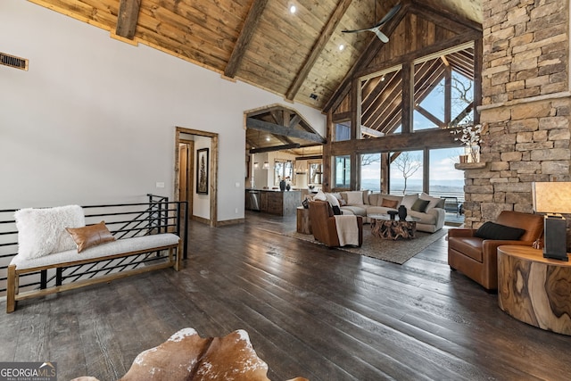 living area with beam ceiling, visible vents, wooden ceiling, and wood-type flooring