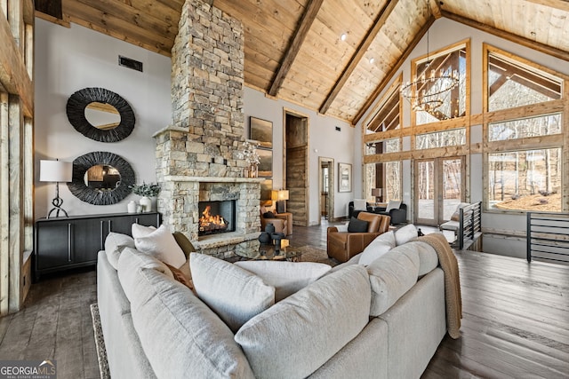 living area with wooden ceiling, a fireplace, an inviting chandelier, and hardwood / wood-style flooring