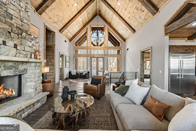 living area featuring wooden ceiling, wood finished floors, and beam ceiling