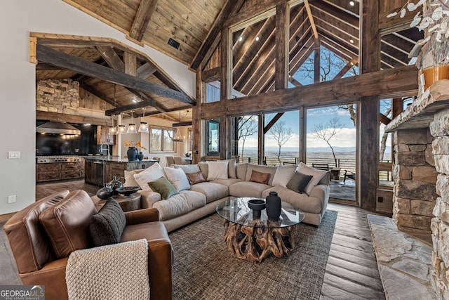 living room with visible vents, beam ceiling, wooden ceiling, wood finished floors, and high vaulted ceiling