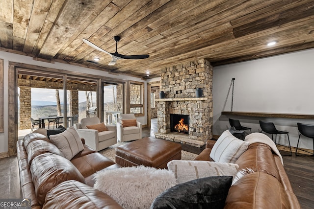 living area with a wealth of natural light, wooden ceiling, and wood finished floors