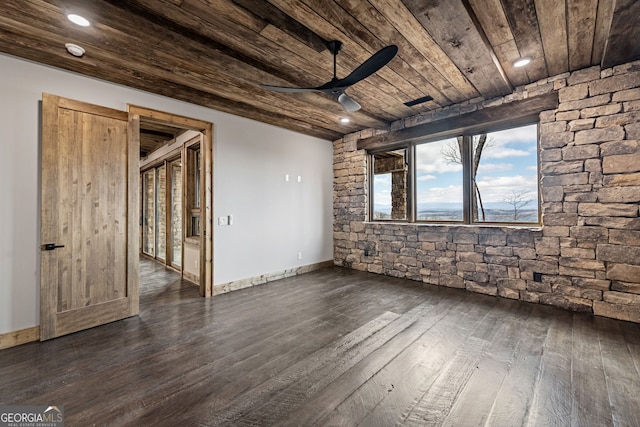 empty room featuring ceiling fan, baseboards, wooden ceiling, and dark wood finished floors