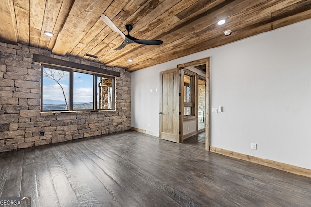 unfurnished room featuring wooden ceiling, baseboards, dark wood-type flooring, and ceiling fan