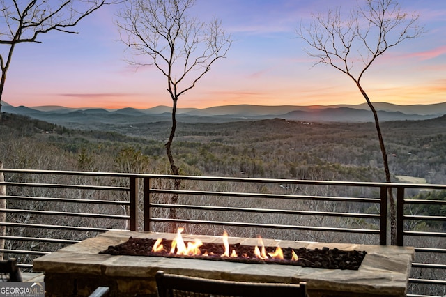 view of mountain feature with a forest view