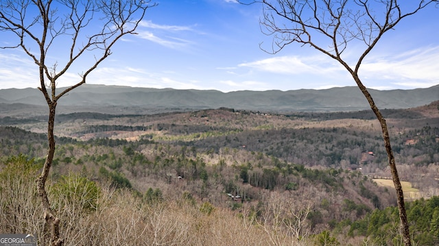 mountain view featuring a view of trees