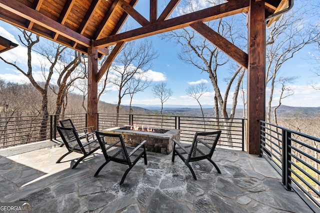 view of patio with a fire pit