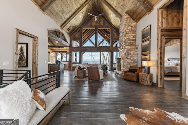 living room featuring beamed ceiling, high vaulted ceiling, wooden ceiling, and hardwood / wood-style flooring