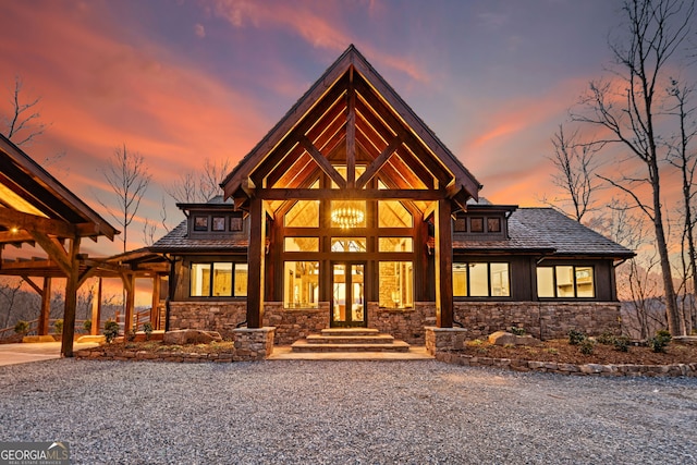 view of front of property with french doors and stone siding