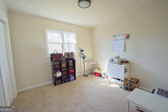 game room with baseboards, a textured ceiling, and carpet