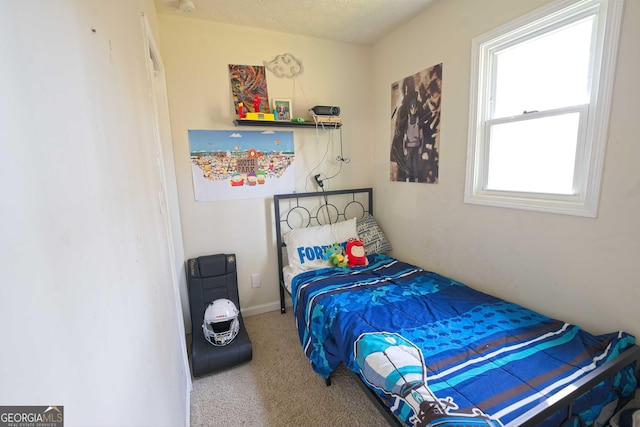 bedroom with baseboards and carpet floors