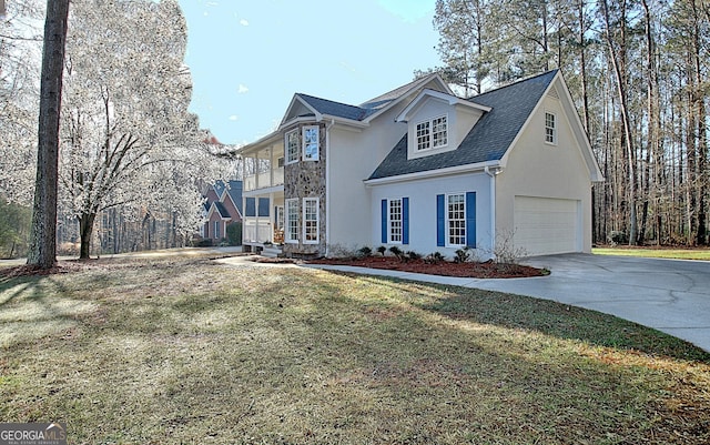 view of front facade featuring stucco siding, concrete driveway, a front yard, a shingled roof, and a balcony