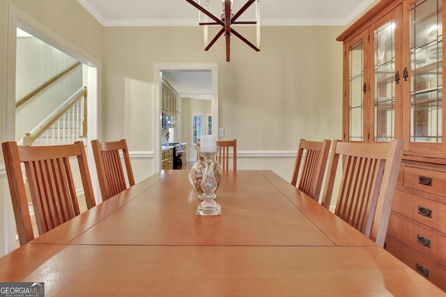 dining room featuring crown molding