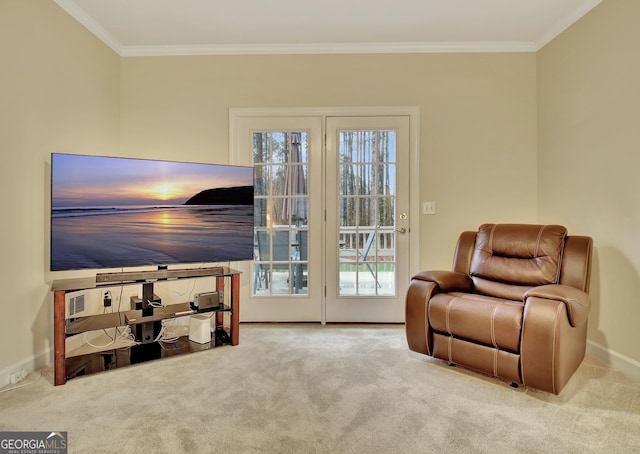 living area with crown molding, baseboards, and carpet floors