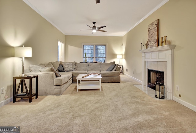 living room with ceiling fan, baseboards, carpet, and ornamental molding