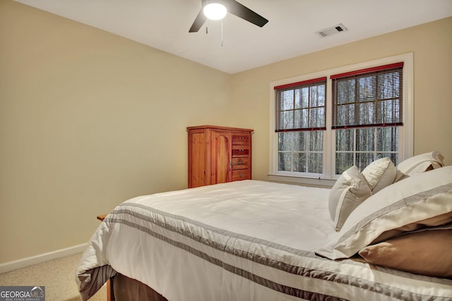 bedroom with visible vents, carpet flooring, baseboards, and ceiling fan