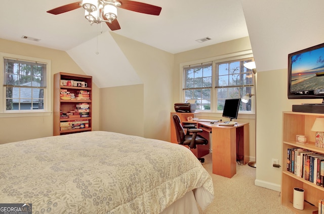 bedroom featuring lofted ceiling, multiple windows, carpet, and visible vents