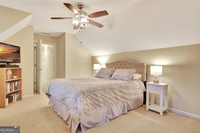 carpeted bedroom with a ceiling fan, lofted ceiling, baseboards, and visible vents