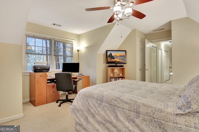 bedroom with visible vents, baseboards, light colored carpet, and vaulted ceiling