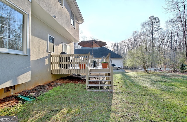 view of yard with a deck