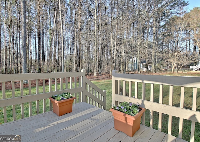 deck featuring a yard