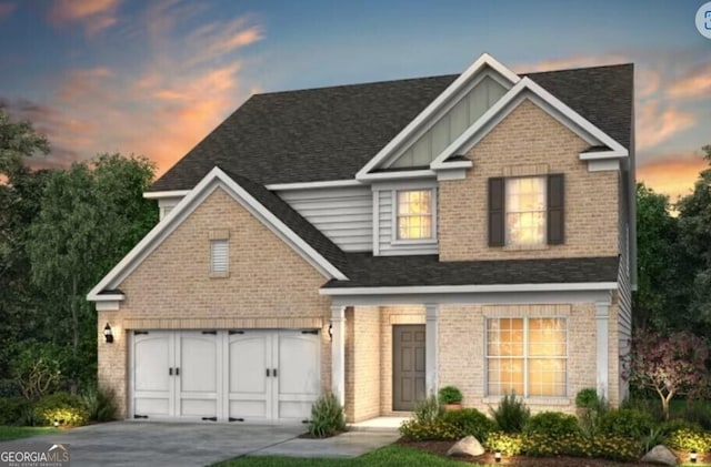 view of front of home with board and batten siding, concrete driveway, a shingled roof, a garage, and brick siding