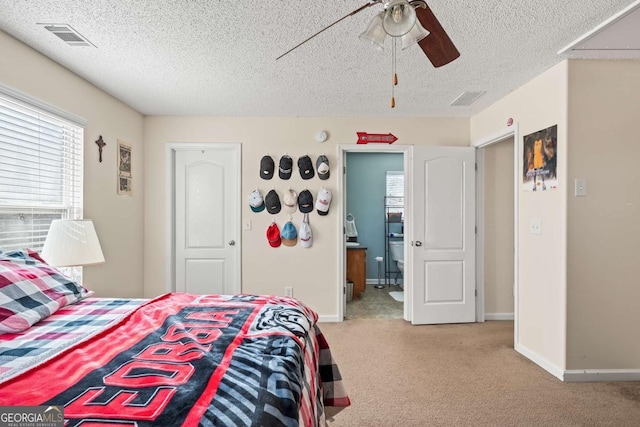 bedroom featuring visible vents, carpet floors, baseboards, and a ceiling fan