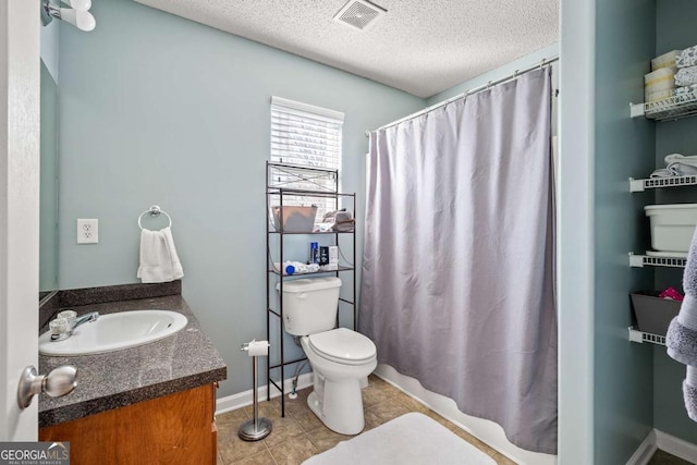 full bathroom featuring tile patterned floors, visible vents, toilet, a textured ceiling, and vanity