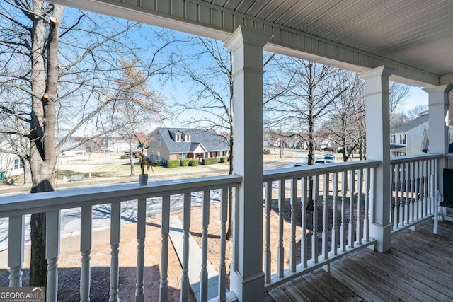 deck featuring a residential view and covered porch