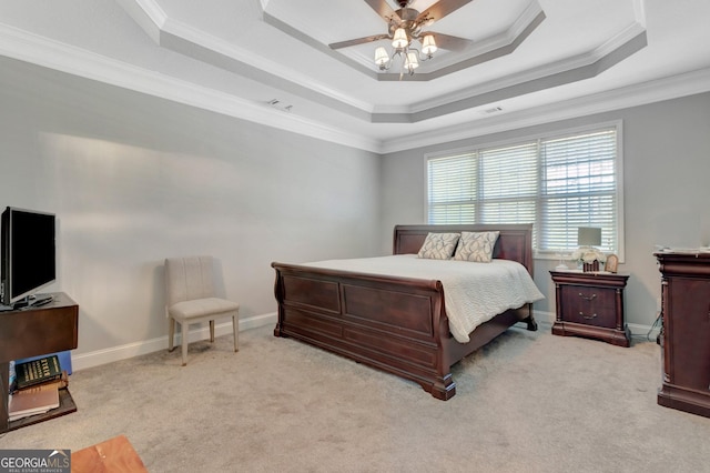 bedroom with baseboards, a raised ceiling, carpet, and ornamental molding