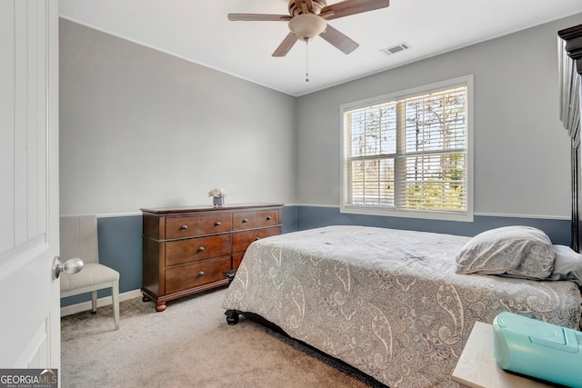 bedroom featuring carpet flooring, a ceiling fan, visible vents, and baseboards