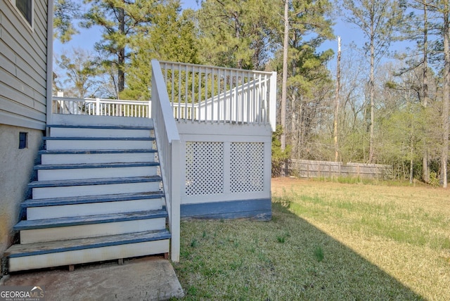 view of yard with a wooden deck and stairs