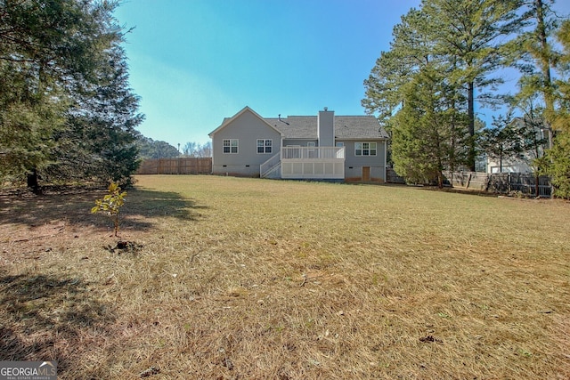 view of yard featuring stairway and fence