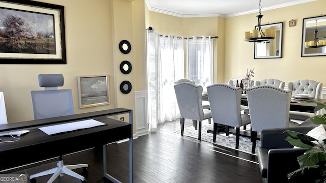 dining room with dark wood-style flooring and ornamental molding