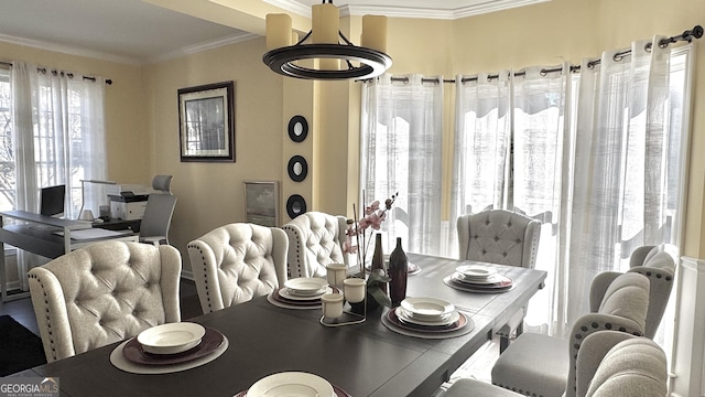 dining space with ornamental molding