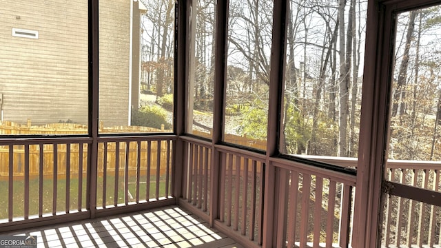 unfurnished sunroom featuring a healthy amount of sunlight