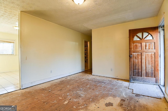 interior space with a textured ceiling