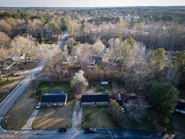 drone / aerial view with a view of trees