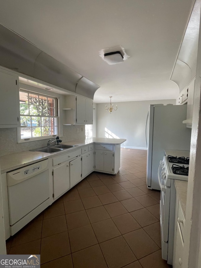 kitchen with dark tile patterned flooring, a sink, open shelves, white appliances, and white cabinets