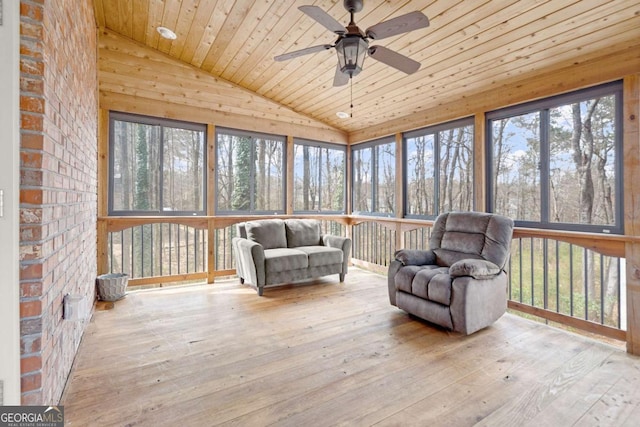 unfurnished sunroom featuring ceiling fan, wood ceiling, and lofted ceiling