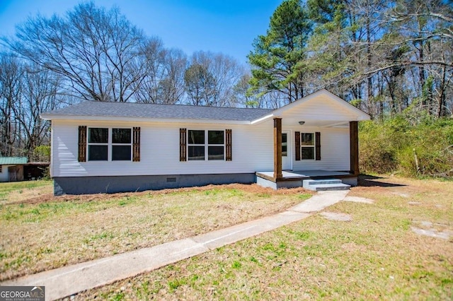 view of front of house featuring crawl space, covered porch, and a front yard