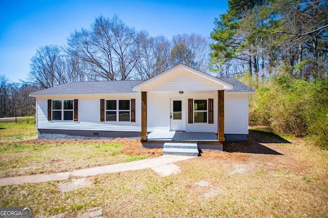 view of front facade with crawl space, a porch, and a shingled roof