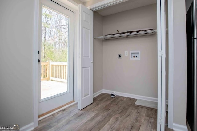 laundry area with electric dryer hookup, wood finished floors, baseboards, hookup for a washing machine, and laundry area