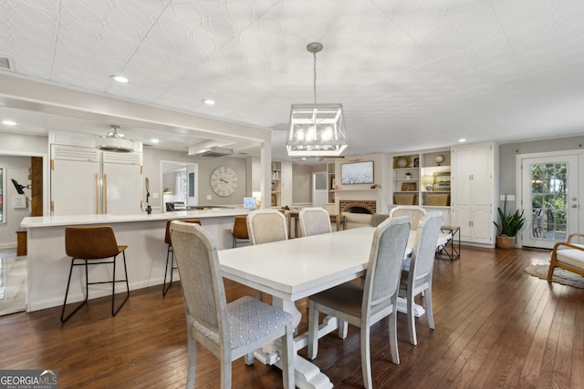 dining area featuring recessed lighting, visible vents, a notable chandelier, and dark wood-style floors